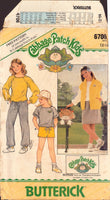 Butterick 6706 Cabbage Patch Kids Top, Vest, Skirt, Shorts and Pants with Transfer, Uncut, Factory Folded Sewing Pattern Size 12-14